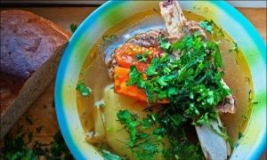 Beef shurpa soup: preparing the famous Asian dish Beef shurpa at home in a saucepan