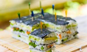 Layered Sushi salad with red fish Sushi salad with nori sheets